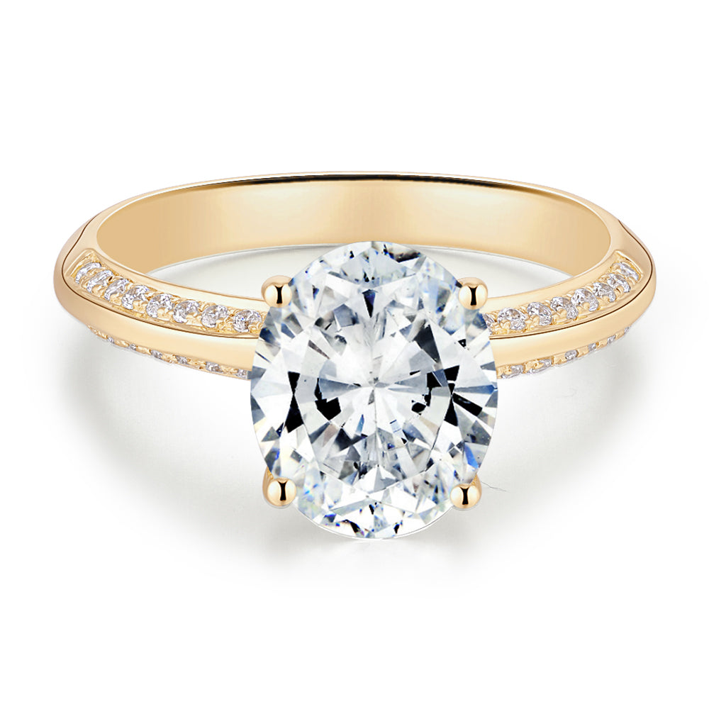 Oval and Round Brilliant shouldered engagement ring with 2.74 carats* of diamond simulants in 14 carat yellow gold