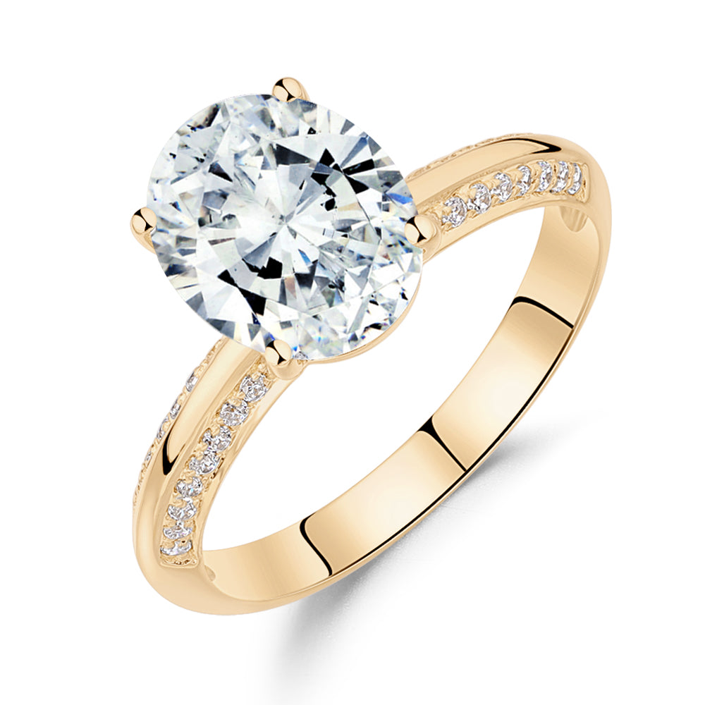 Oval and Round Brilliant shouldered engagement ring with 2.74 carats* of diamond simulants in 14 carat yellow gold