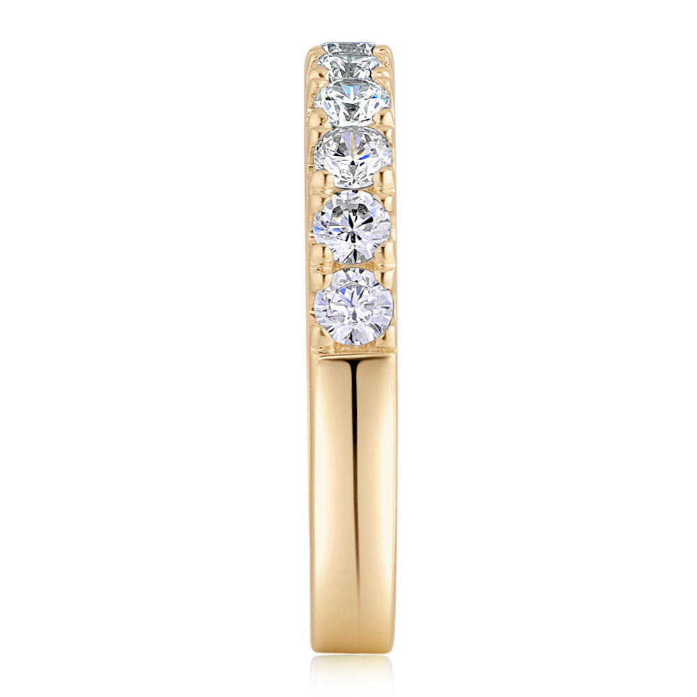 Wedding or eternity band with 0.88 carats* of diamond simulants in 14 carat yellow gold