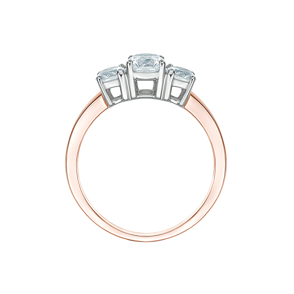 Three stone ring with 1 carats* of diamond simulants in 10 carat rose and white gold