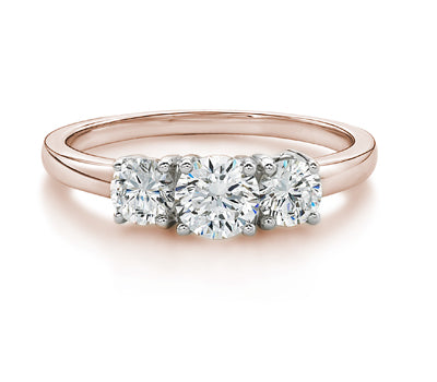 Three stone ring with 1 carats* of diamond simulants in 10 carat rose and white gold