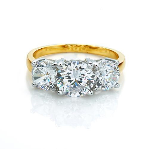 Three stone ring with 3 carats* of diamond simulants in 10 carat yellow and white gold