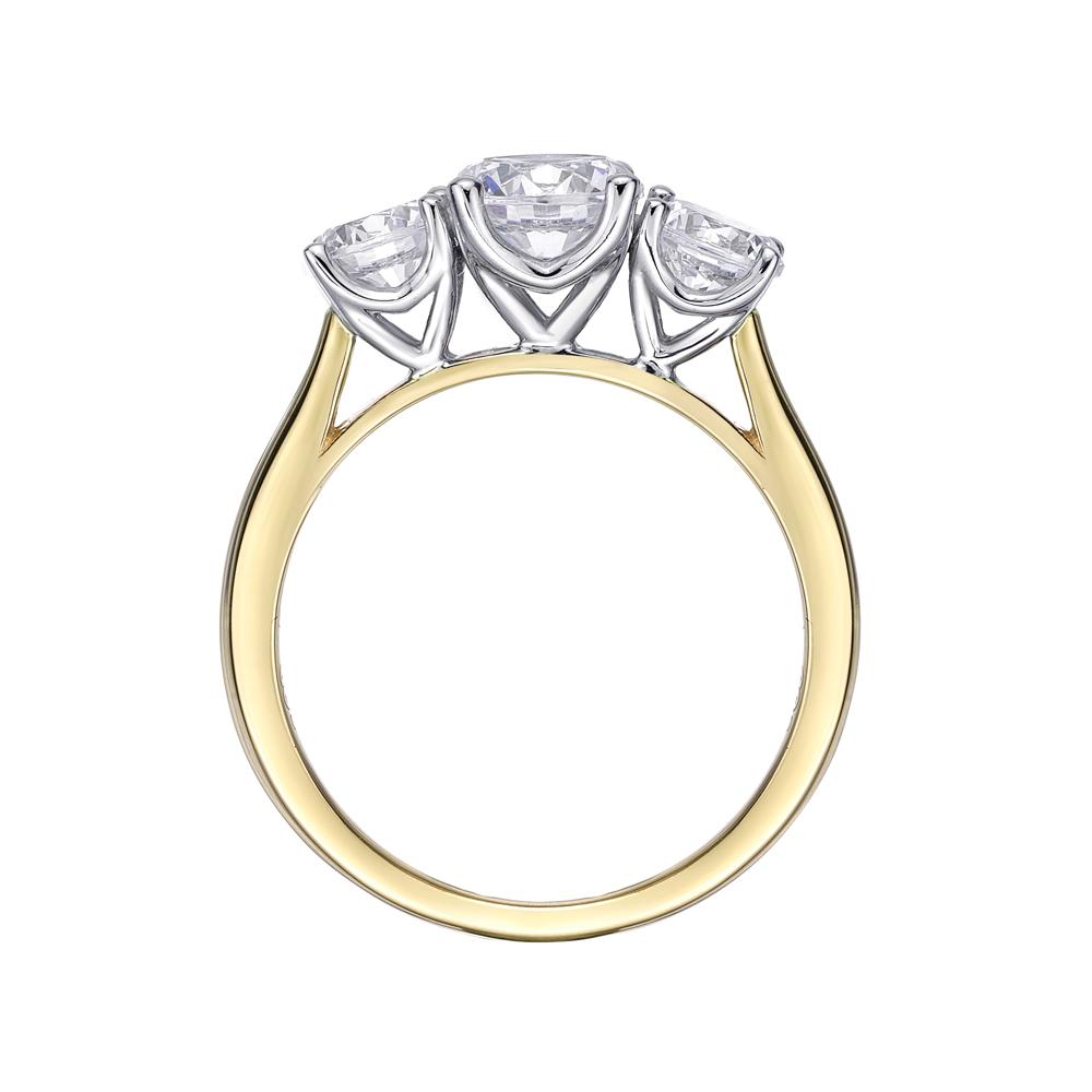Three stone ring with 2 carats* of diamond simulants in 10 carat yellow and white gold