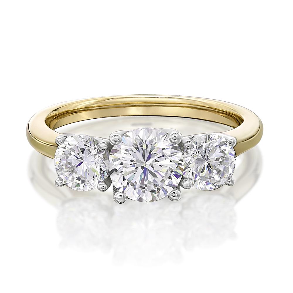 Three stone ring with 2 carats* of diamond simulants in 10 carat yellow and white gold