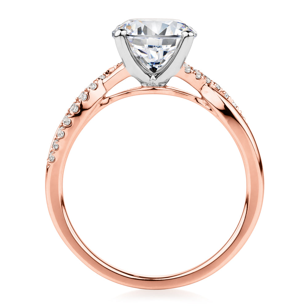 Round Brilliant shouldered engagement ring with 2.17 carats* of diamond simulants in 14 carat rose and white gold