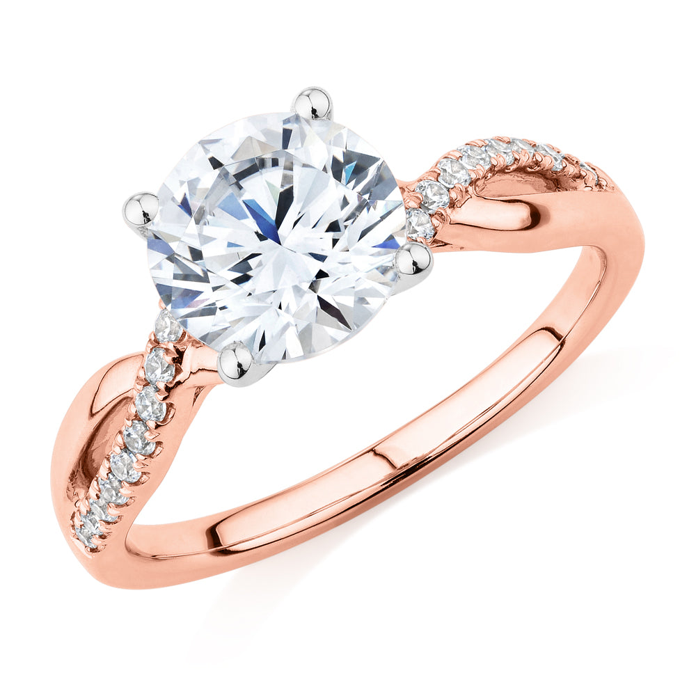Round Brilliant shouldered engagement ring with 2.17 carats* of diamond simulants in 14 carat rose and white gold
