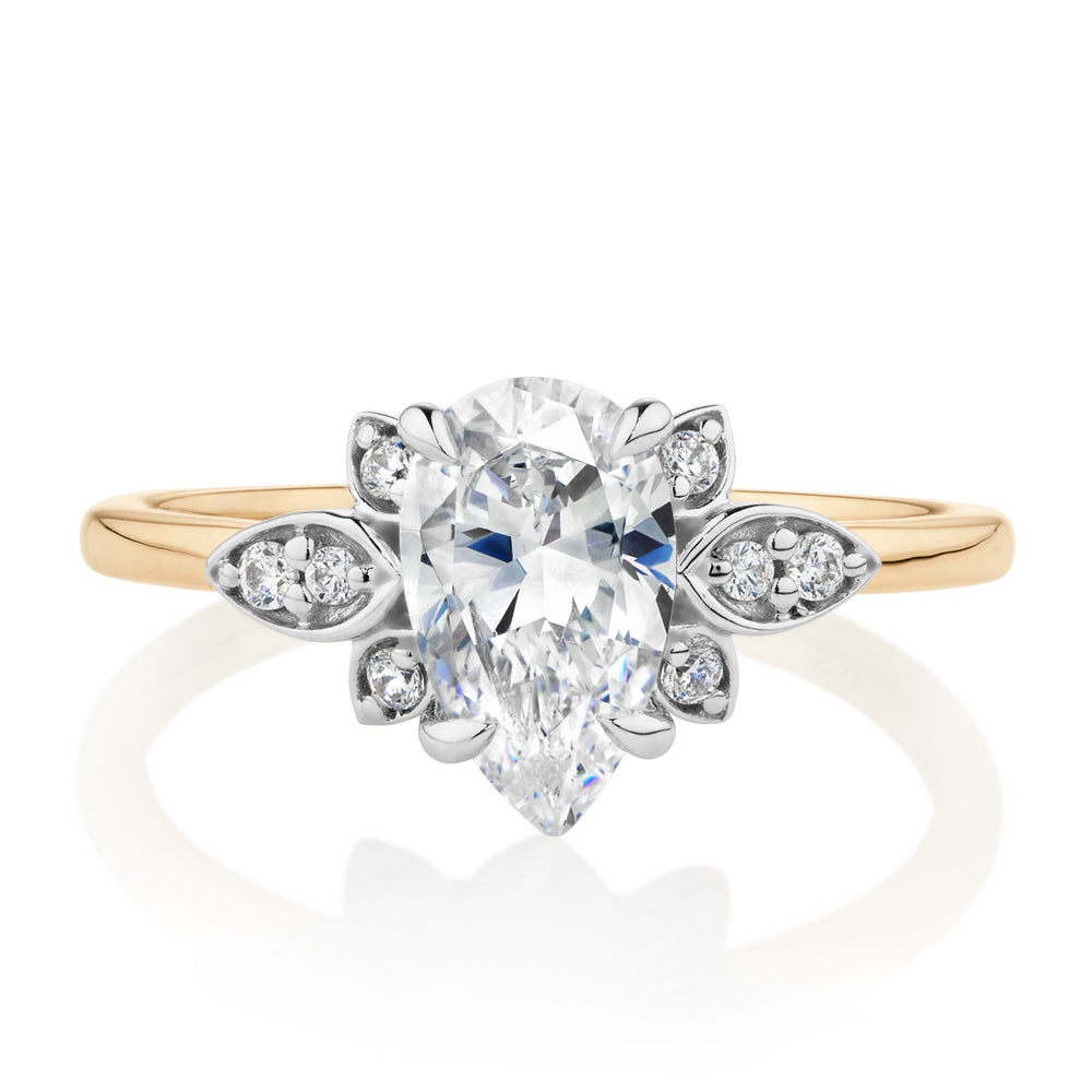 Pear and Round Brilliant shouldered engagement ring with 1.8 carats* of diamond simulants in 14 carat yellow and white gold