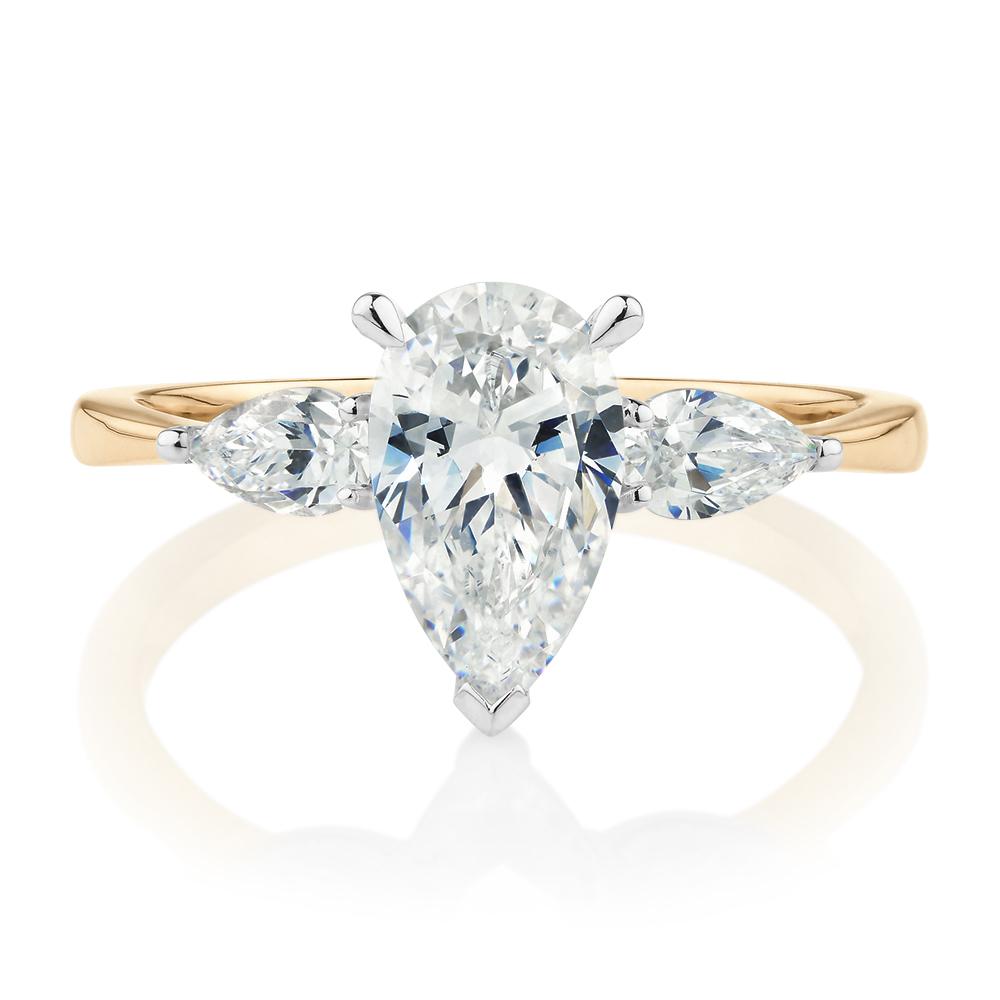 Pear shouldered engagement ring with 2.21 carats* of diamond simulants in 14 carat yellow and white gold