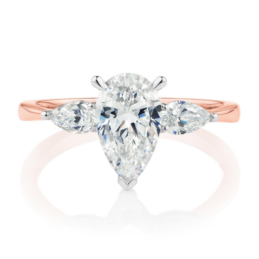 Pear shouldered engagement ring with 2.21 carats* of diamond simulants in 14 carat rose and white gold