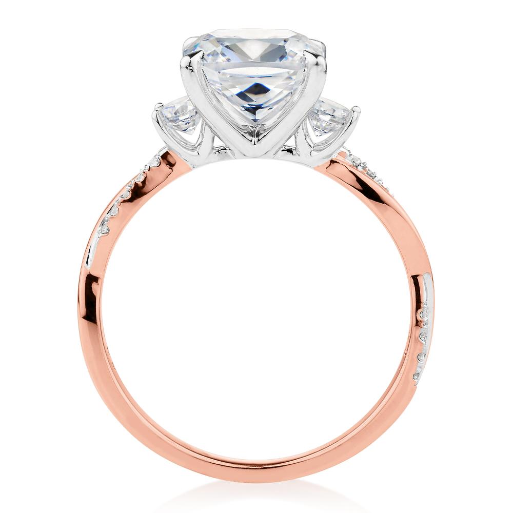 Cushion and Round Brilliant shouldered engagement ring with 2.35 carats* of diamond simulants in 14 carat rose and white gold