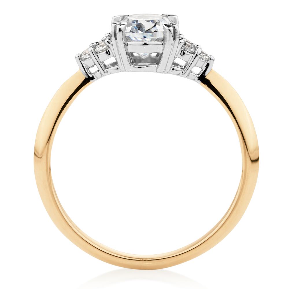 Oval and Round Brilliant shouldered engagement ring with 1.3 carats* of diamond simulants in 14 carat yellow and white gold