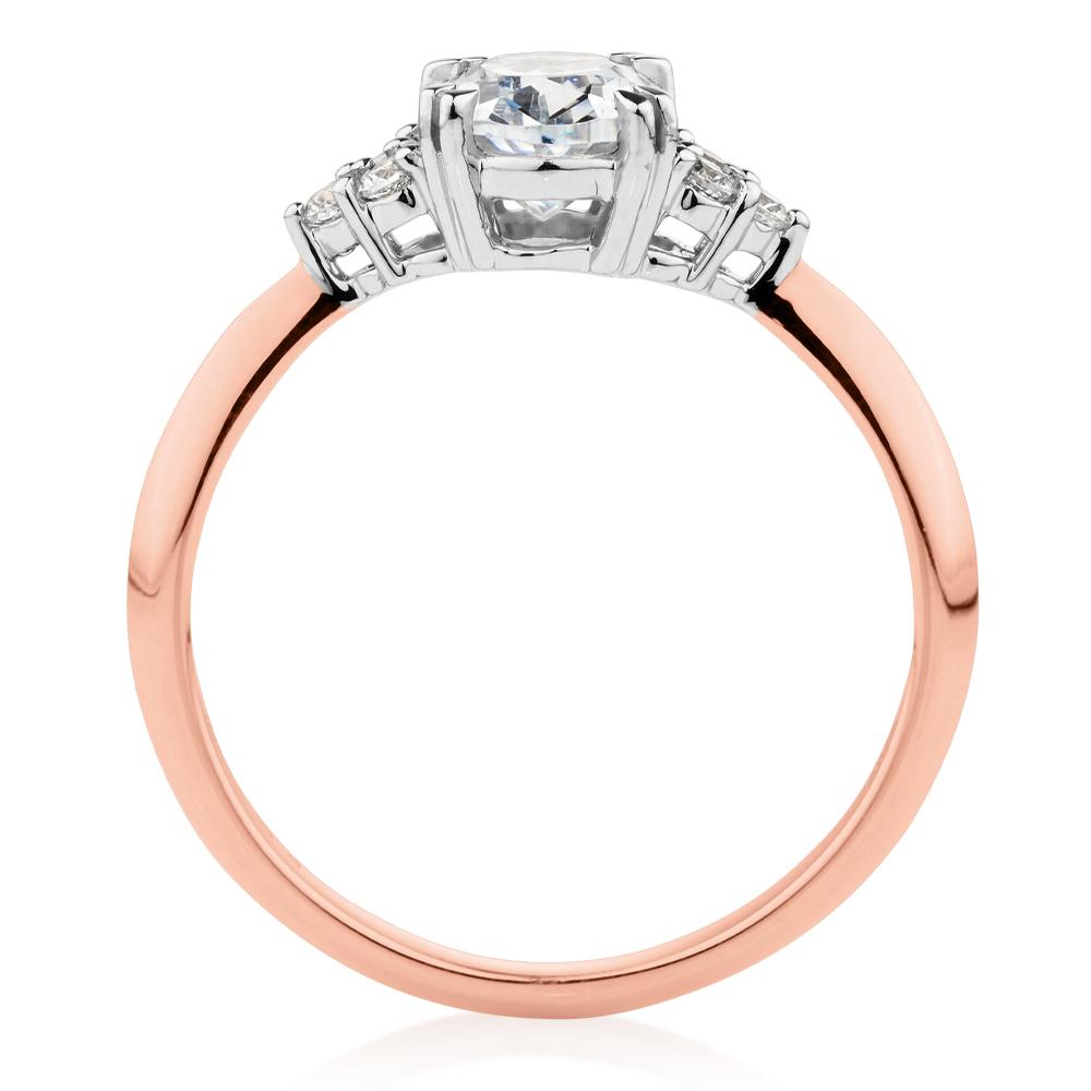 Oval and Round Brilliant shouldered engagement ring with 1.3 carats* of diamond simulants in 14 carat rose and white gold