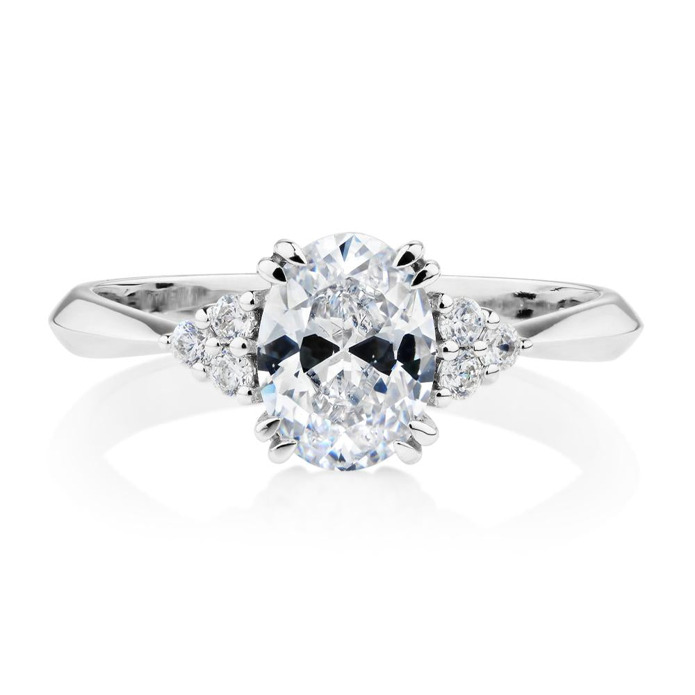 Oval and Round Brilliant shouldered engagement ring with 1.3 carats* of diamond simulants in 14 carat white gold