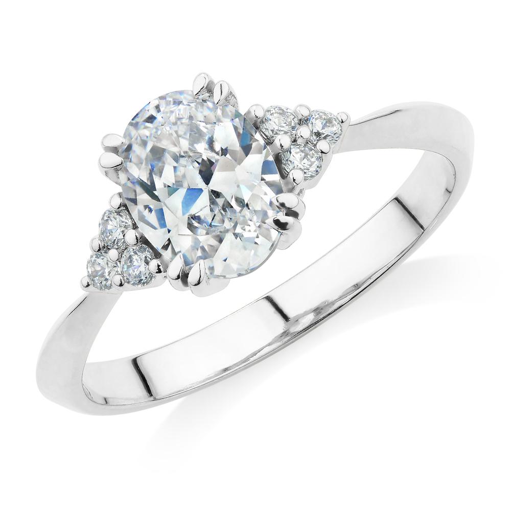 Oval and Round Brilliant shouldered engagement ring with 1.3 carats* of diamond simulants in 14 carat white gold