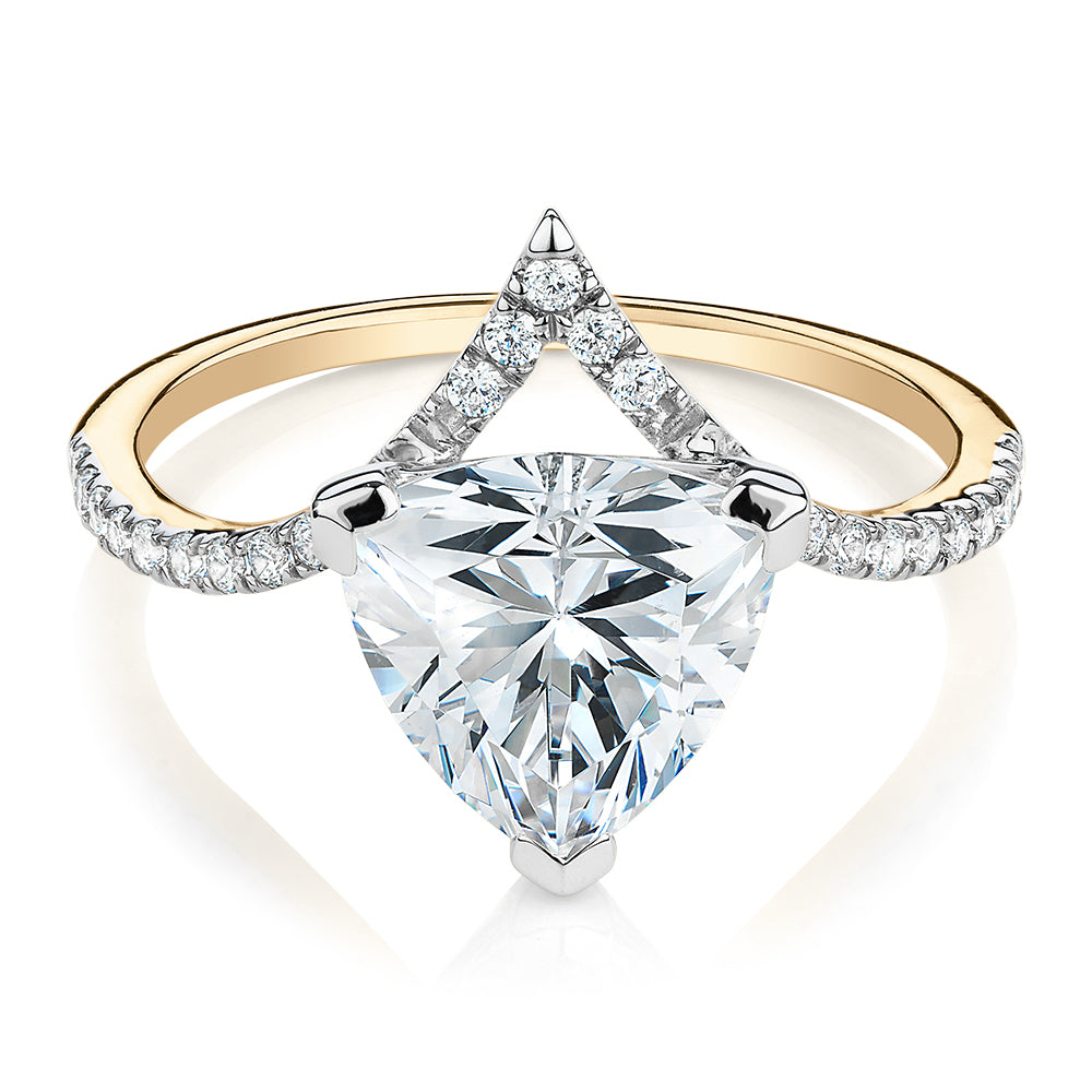Trilliant and Round Brilliant shouldered engagement ring with 2.52 carats* of diamond simulants in 14 carat yellow and white gold