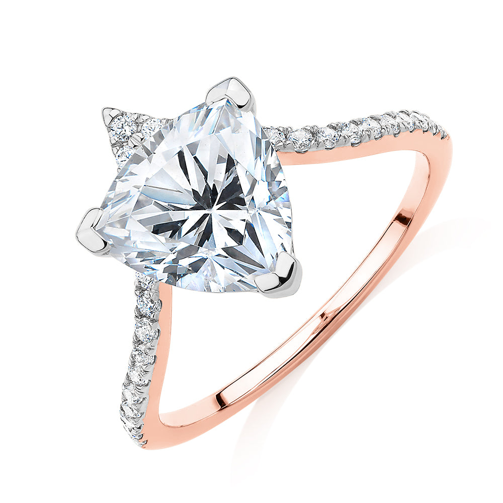 Trilliant and Round Brilliant shouldered engagement ring with 2.52 carats* of diamond simulants in 14 carat rose and white gold