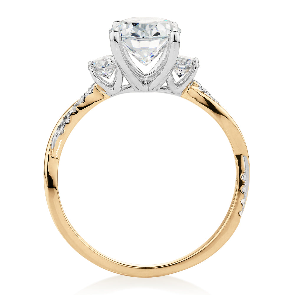 Oval and Round Brilliant shouldered engagement ring with 2.17 carats* of diamond simulants in 14 carat yellow and white gold