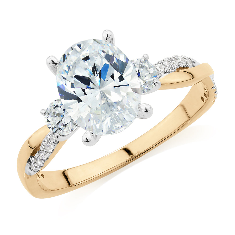 Oval and Round Brilliant shouldered engagement ring with 2.17 carats* of diamond simulants in 14 carat yellow and white gold