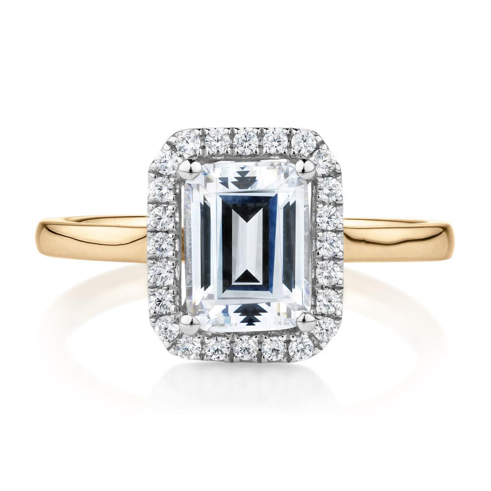 Emerald Cut and Round Brilliant halo engagement ring with 1.92 carats* of diamond simulants in 14 carat yellow and white gold
