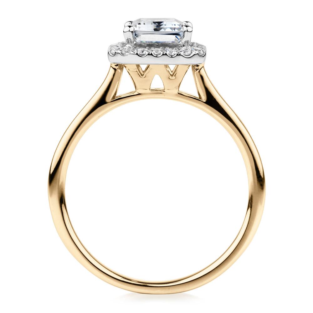 Emerald Cut and Round Brilliant halo engagement ring with 1.92 carats* of diamond simulants in 14 carat yellow and white gold
