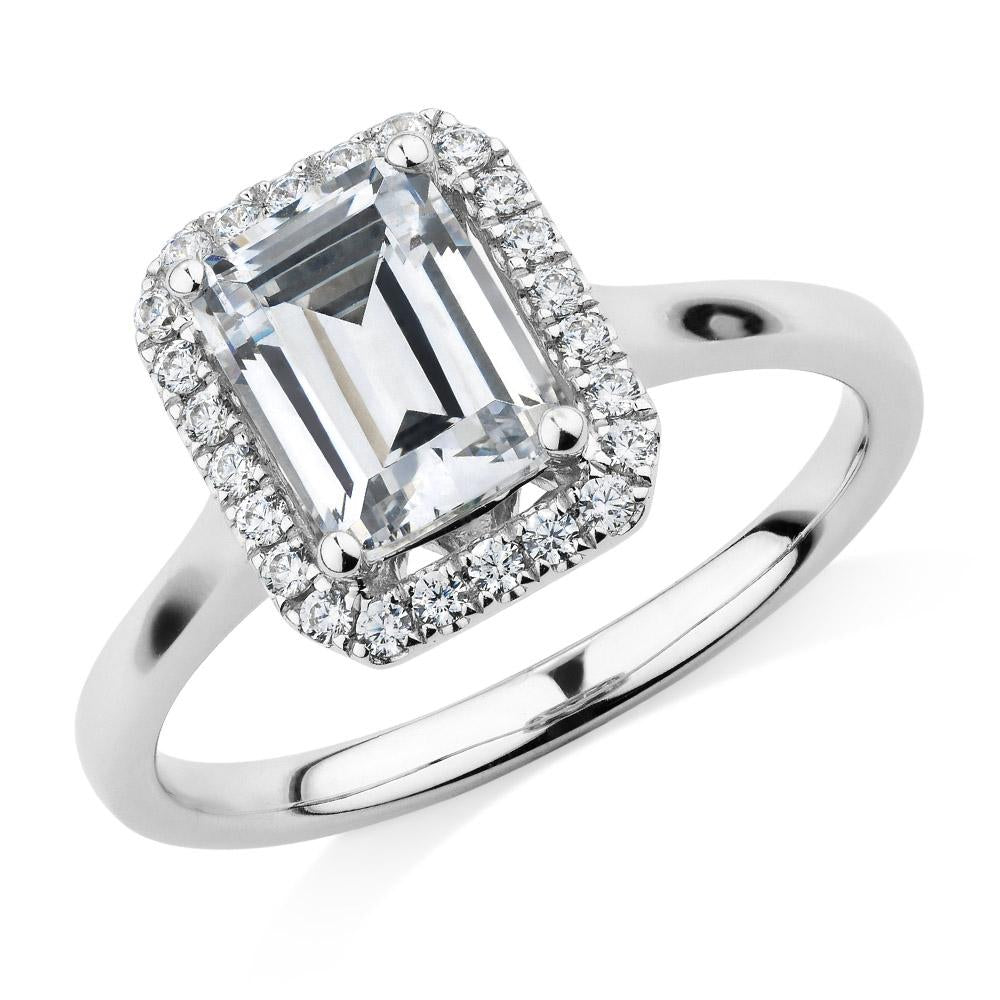 Emerald Cut and Round Brilliant halo engagement ring with 1.92 carats* of diamond simulants in 14 carat white gold