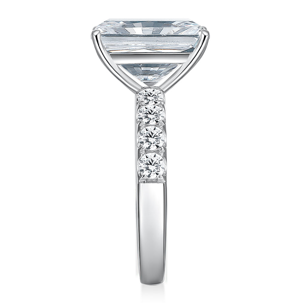 Emerald shouldered engagement ring with 6.64 carats* of diamond simulants in 14 carat white gold