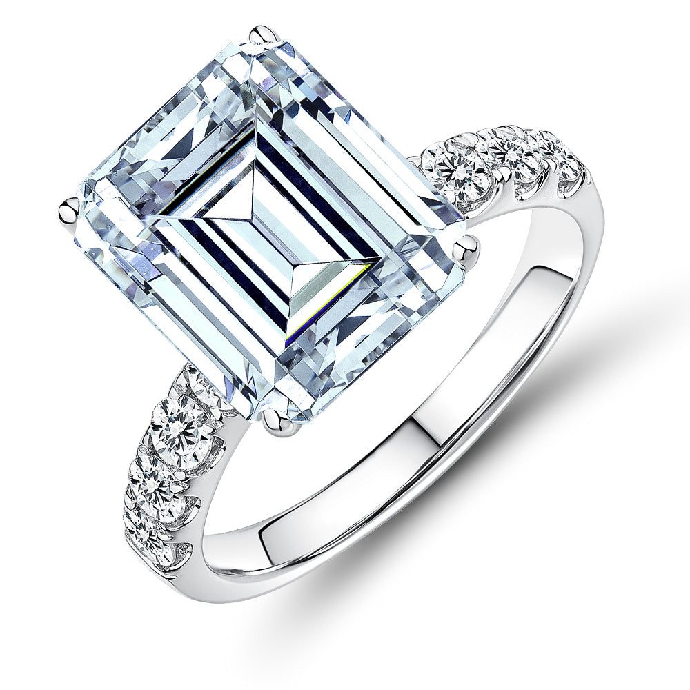 Emerald shouldered engagement ring with 6.64 carats* of diamond simulants in 14 carat white gold
