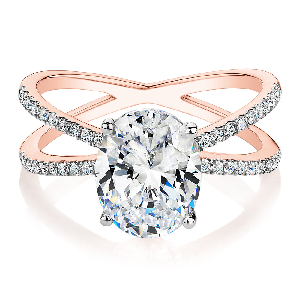 Oval and Round Brilliant shouldered engagement ring with 2.76 carats* of diamond simulants in 14 carat rose and white gold