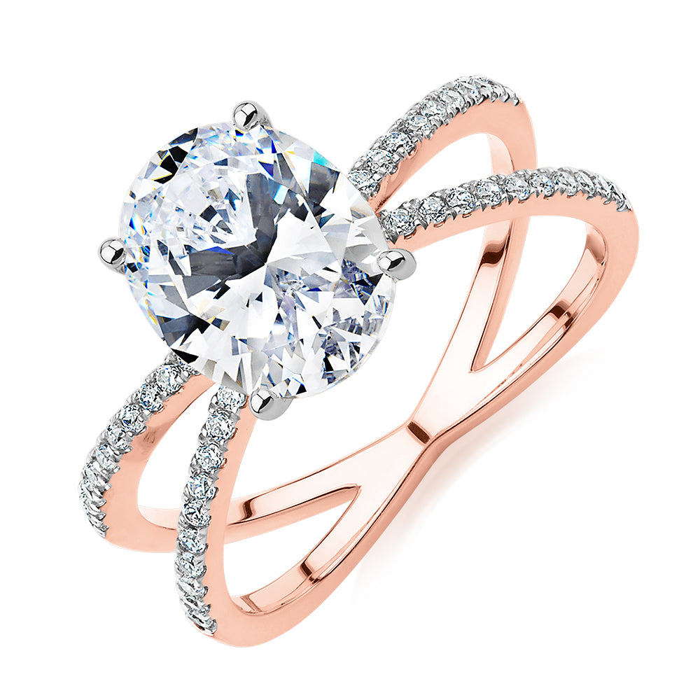 Oval and Round Brilliant shouldered engagement ring with 2.76 carats* of diamond simulants in 14 carat rose and white gold