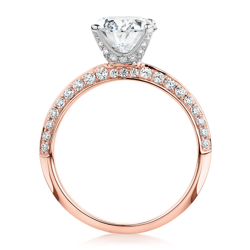 Oval shouldered engagement ring with 2.97 carats* of diamond simulants in 14 carat rose and white gold