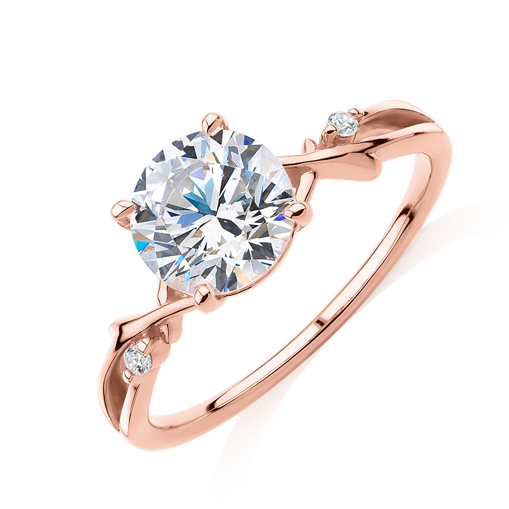 Round Brilliant shouldered engagement ring with 1.69 carats* of diamond simulants in 14 carat rose gold