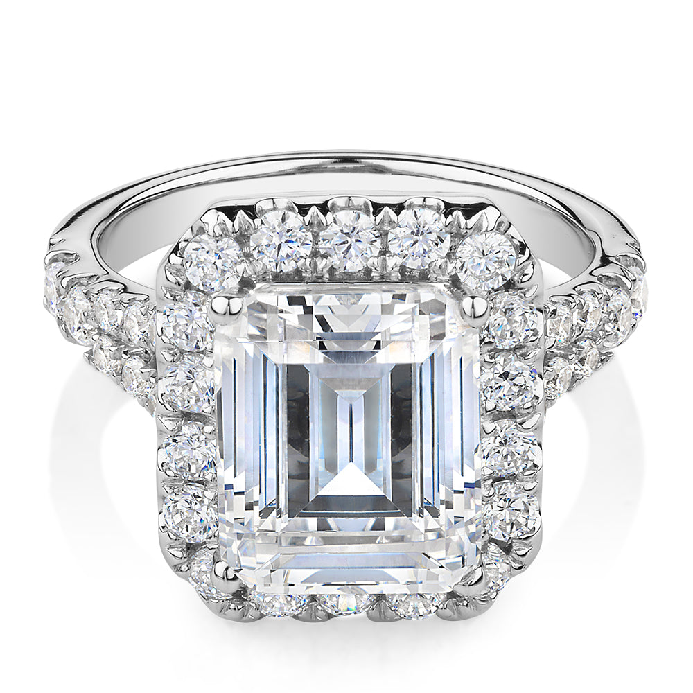 Emerald Cut and Round Brilliant halo engagement ring with 5.95 carats* of diamond simulants in 10 carat white gold