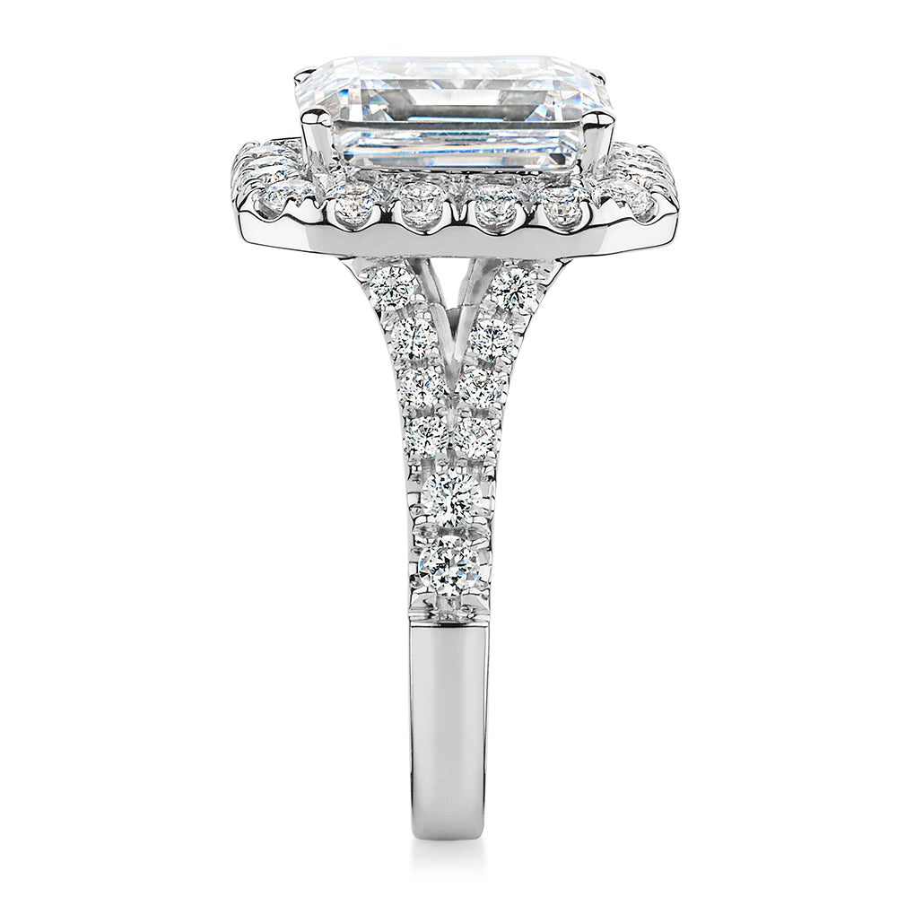 Emerald Cut and Round Brilliant halo engagement ring with 5.95 carats* of diamond simulants in 10 carat white gold