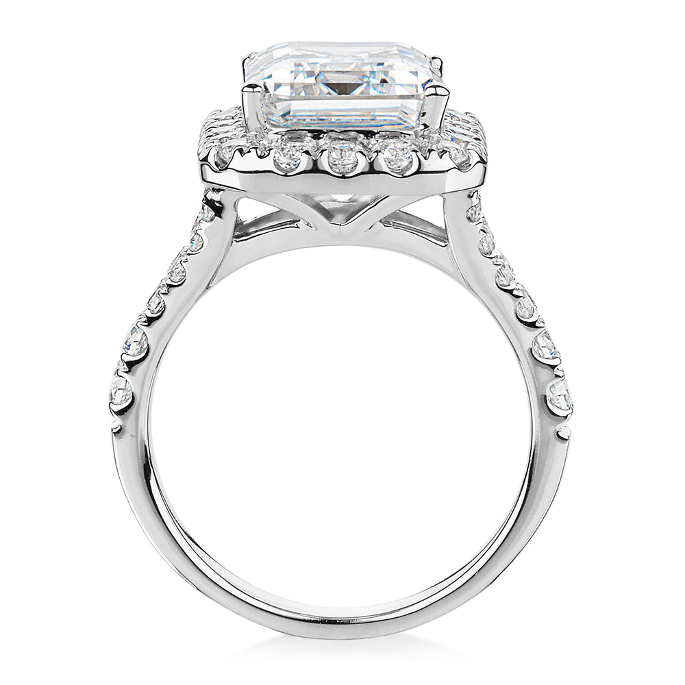 Emerald Cut and Round Brilliant halo engagement ring with 5.95 carats* of diamond simulants in 10 carat white gold