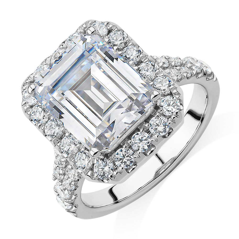Emerald Cut and Round Brilliant halo engagement ring with 5.95 carats* of diamond simulants in 10 carat white gold