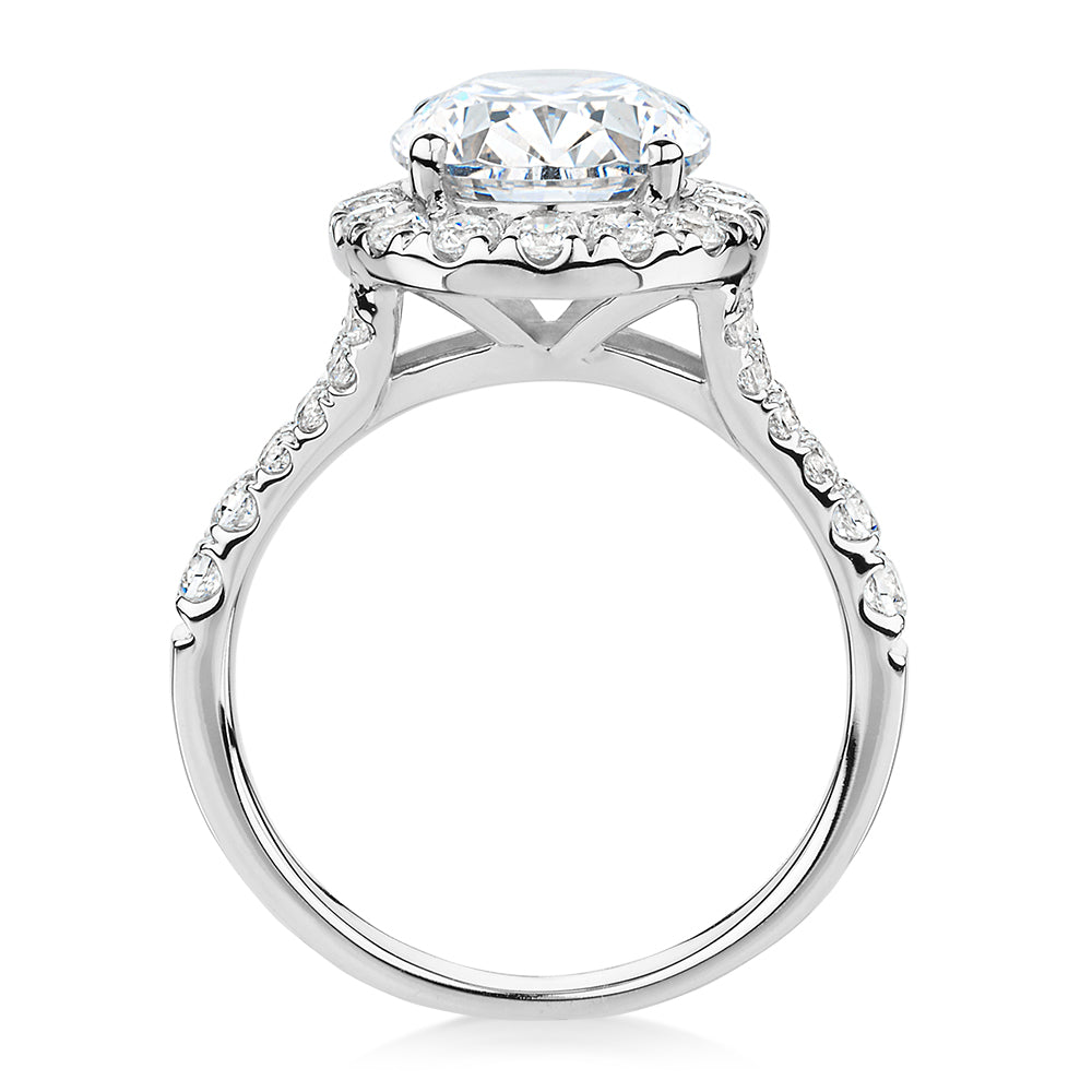 Oval and Round Brilliant halo engagement ring with 4.61 carats* of diamond simulants in 10 carat white gold