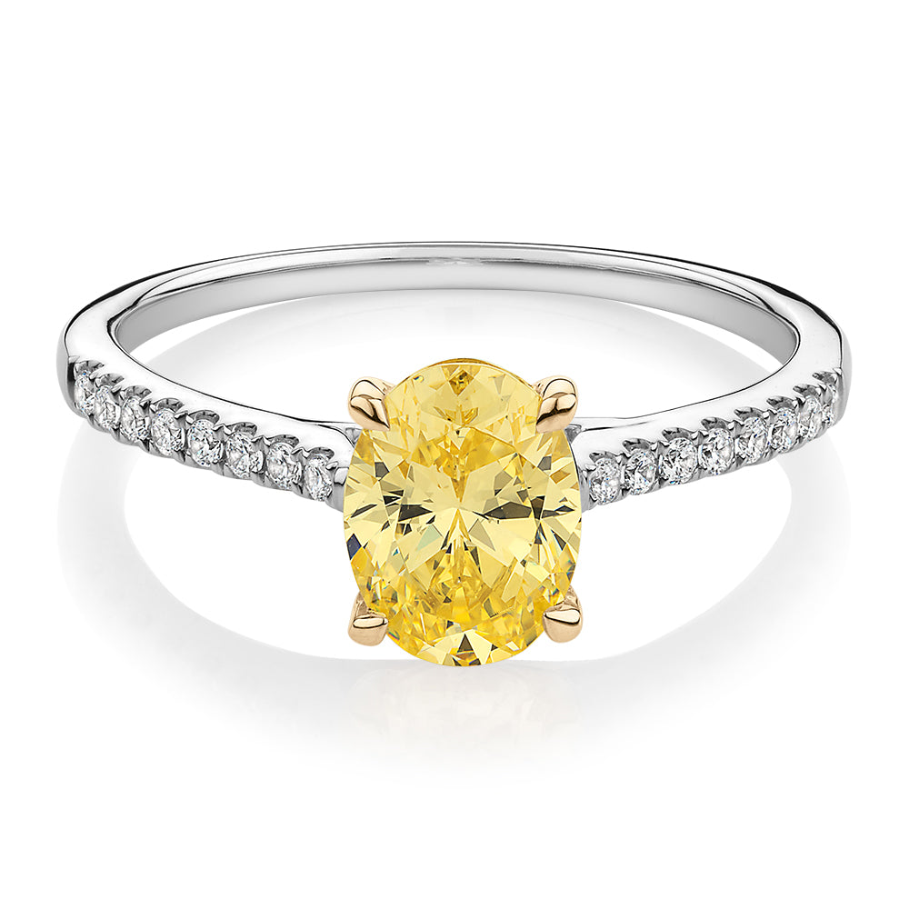 Oval and Round Brilliant shouldered engagement ring with 1.35 carats* of diamond simulants in 10 carat white and yellow gold