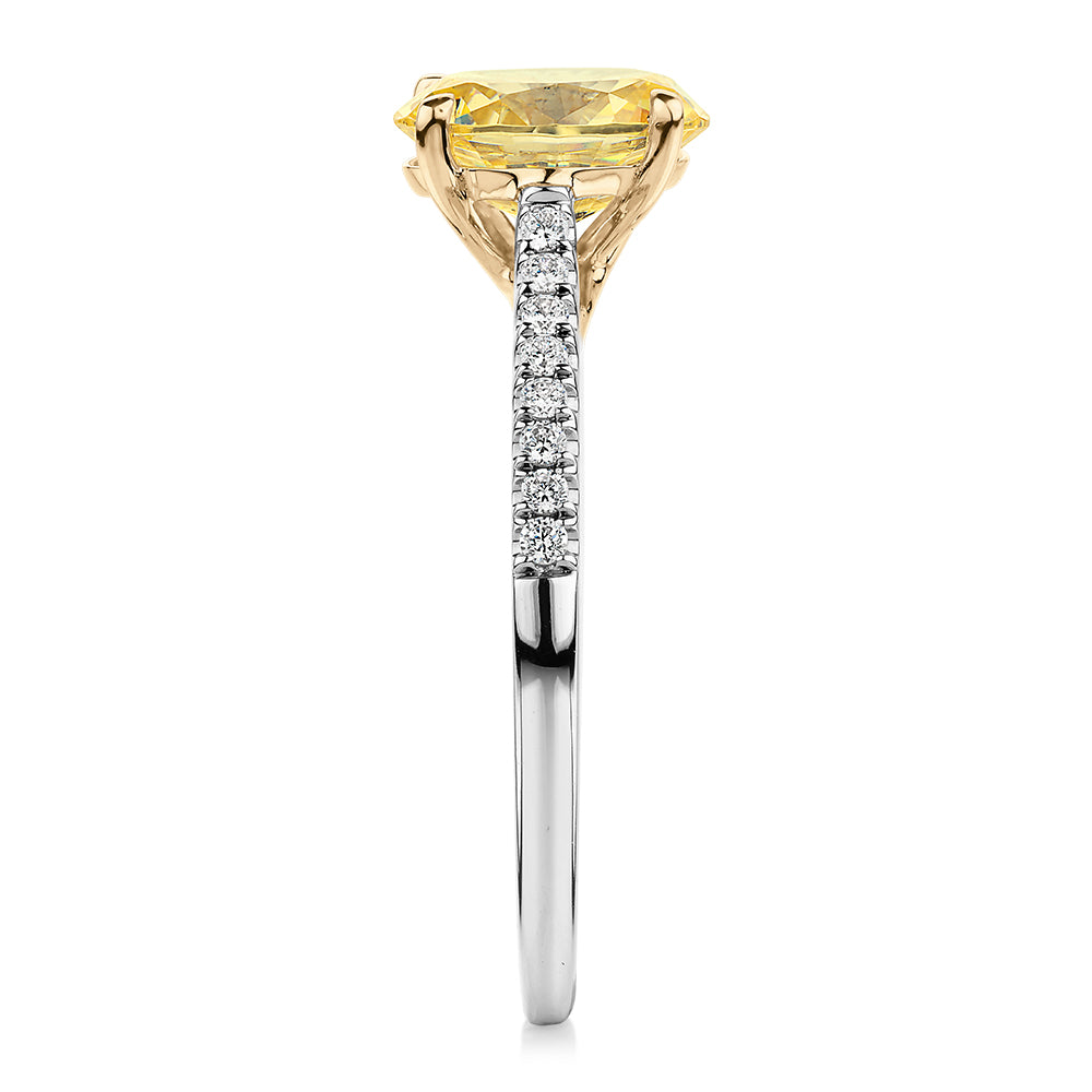 Oval and Round Brilliant shouldered engagement ring with 1.35 carats* of diamond simulants in 10 carat white and yellow gold