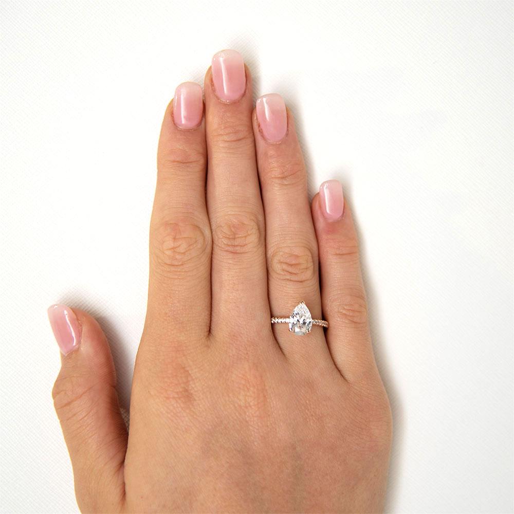 Pear and Round Brilliant shouldered engagement ring with 1.88 carats* of diamond simulants in 14 carat rose gold