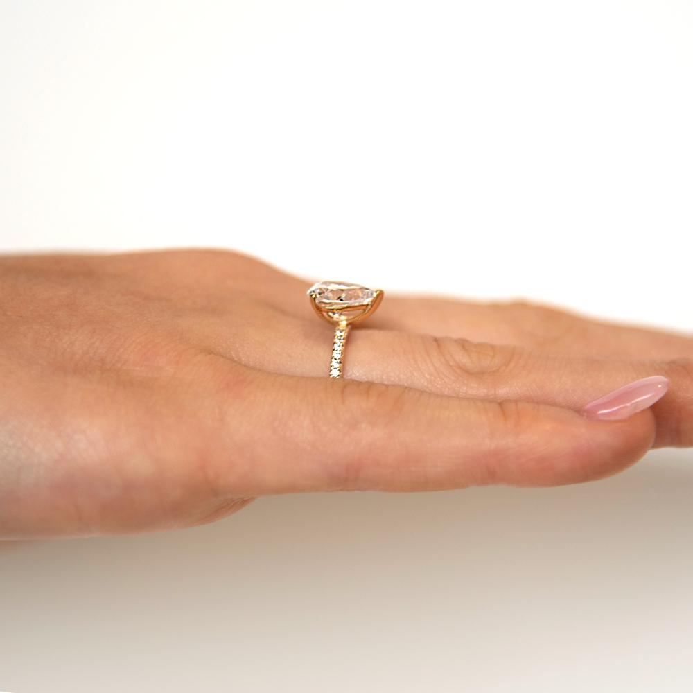 Pear and Round Brilliant shouldered engagement ring with 1.88 carats* of diamond simulants in 14 carat yellow gold