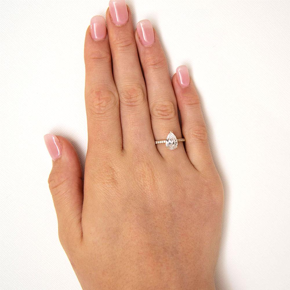 Pear and Round Brilliant shouldered engagement ring with 1.88 carats* of diamond simulants in 14 carat yellow gold