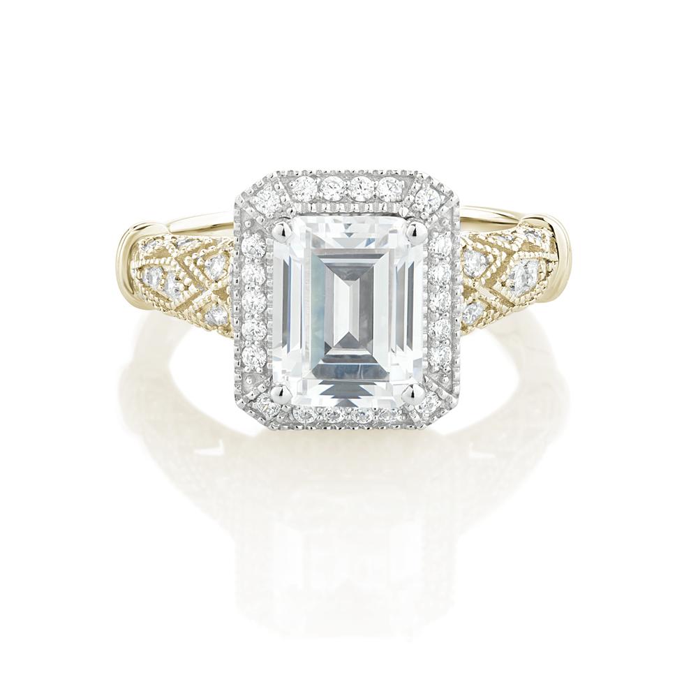 Emerald Cut and Round Brilliant halo engagement ring with 2.9 carats* of diamond simulants in 10 carat yellow and white gold