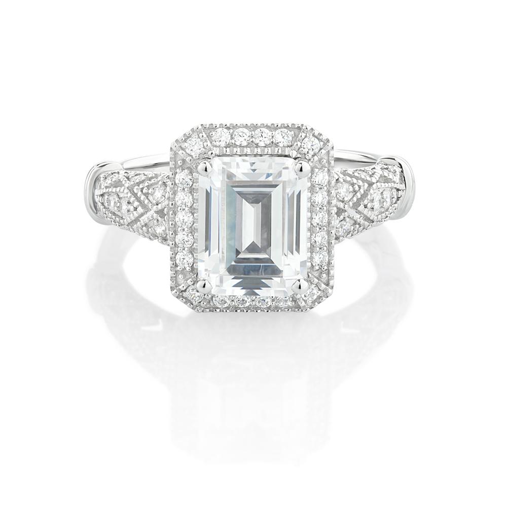 Emerald Cut and Round Brilliant halo engagement ring with 2.9 carats* of diamond simulants in 10 carat white gold