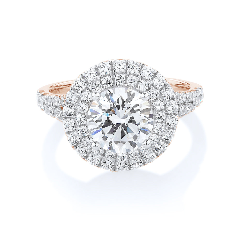 Round Brilliant halo engagement ring with 2.87 carats* of diamond simulants in 10 carat rose gold