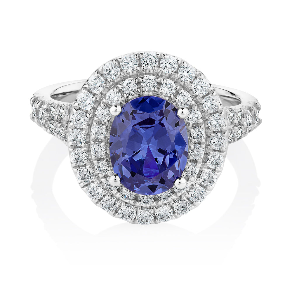 Dress ring with 9x7mm tanzanite simulant and 0.66 carats* of diamond simulants in 10 carat white gold