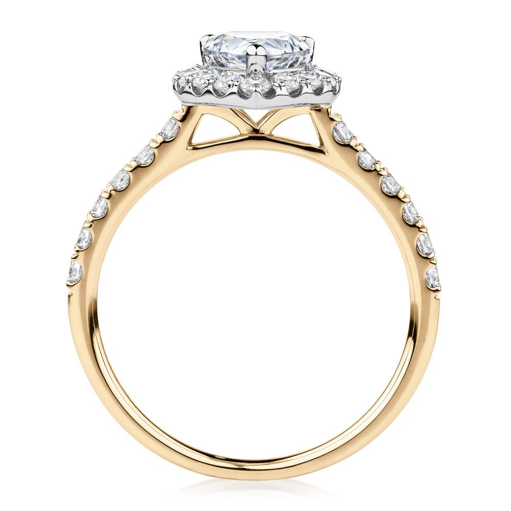 Pear and Round Brilliant halo engagement ring with 1.83 carats* of diamond simulants in 14 carat yellow and white gold