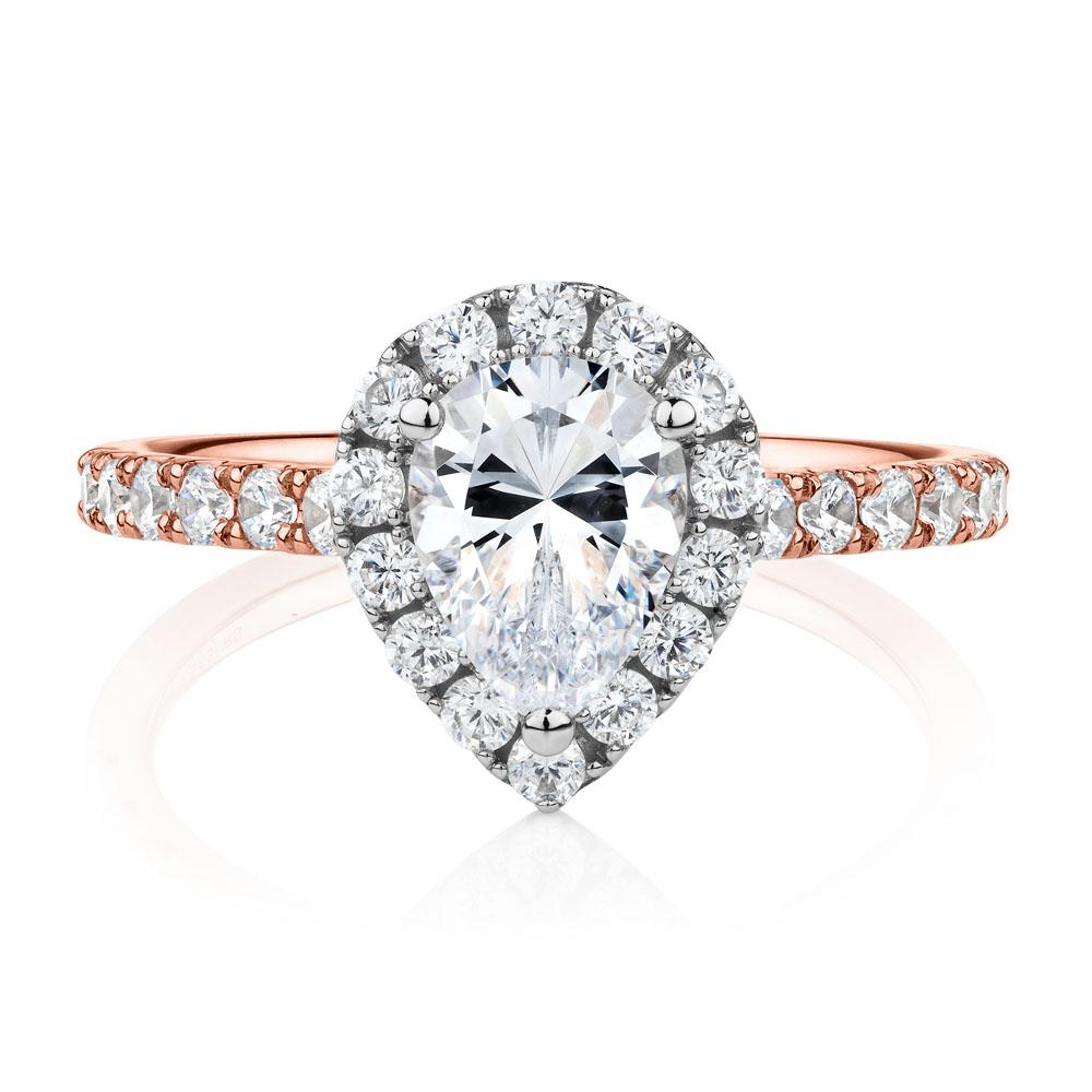 Pear and Round Brilliant halo engagement ring with 1.83 carats* of diamond simulants in 14 carat rose and white gold