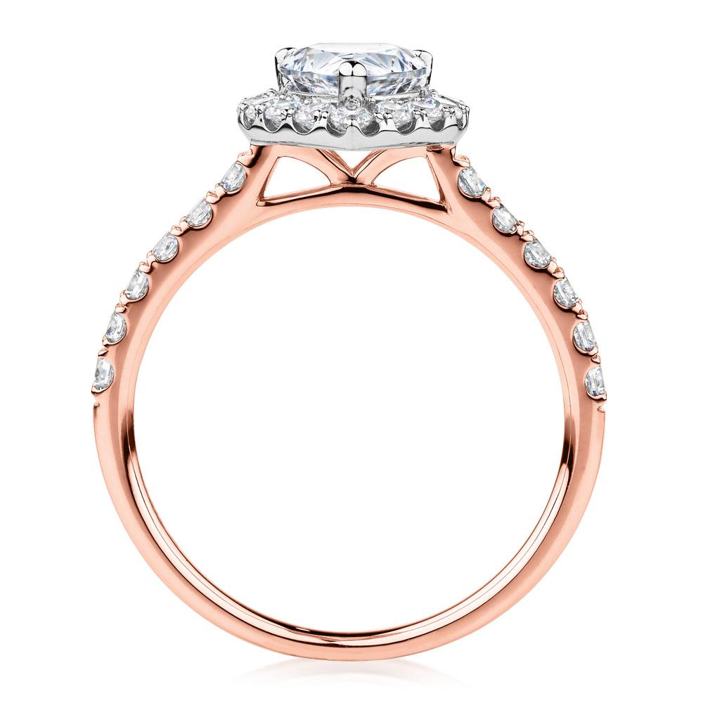 Pear and Round Brilliant halo engagement ring with 1.83 carats* of diamond simulants in 14 carat rose and white gold