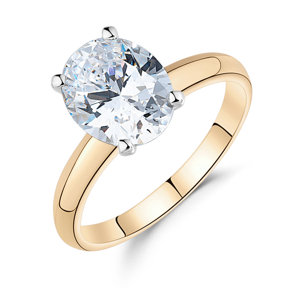 Oval solitaire engagement ring with 2.54 carat* diamond simulant in 14 carat yellow and white gold