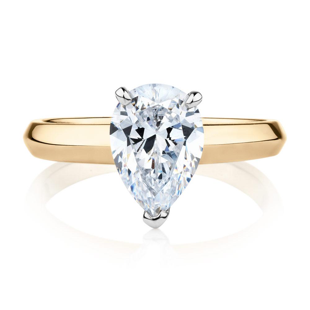Pear solitaire engagement ring with 1.8 carat* diamond simulant in 14 carat yellow and white gold